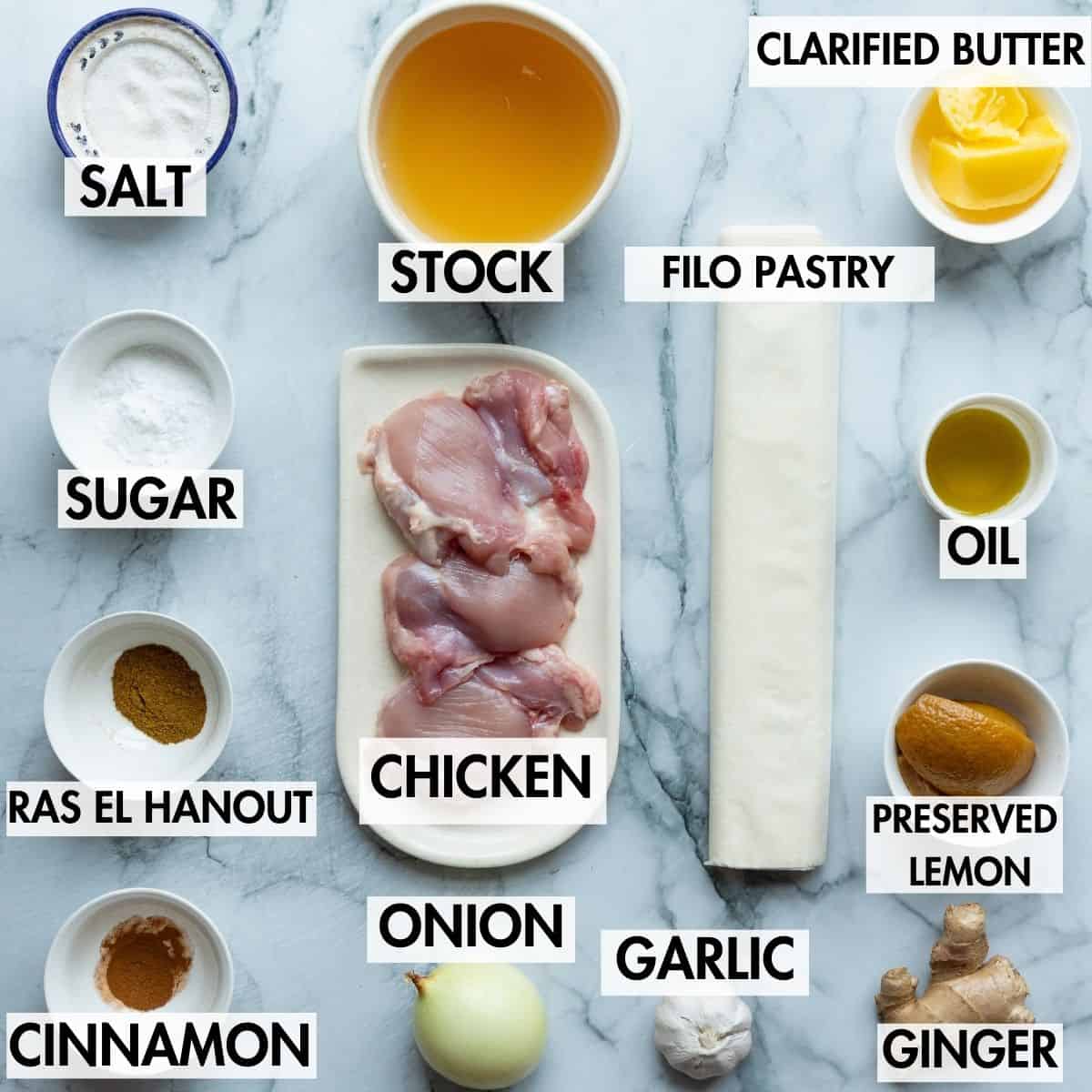 Ingredients for making pastilla on a marble background.