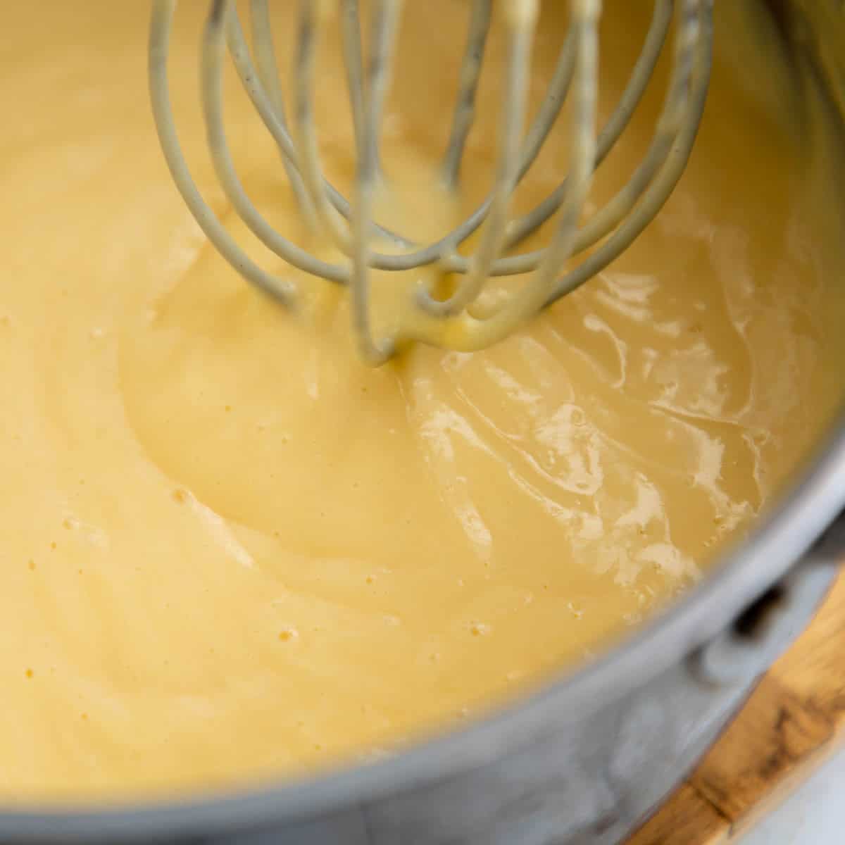 Whisking Custard in a sauce pan.