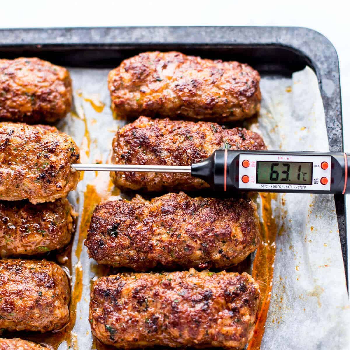 cooked beef koftas on white parchment