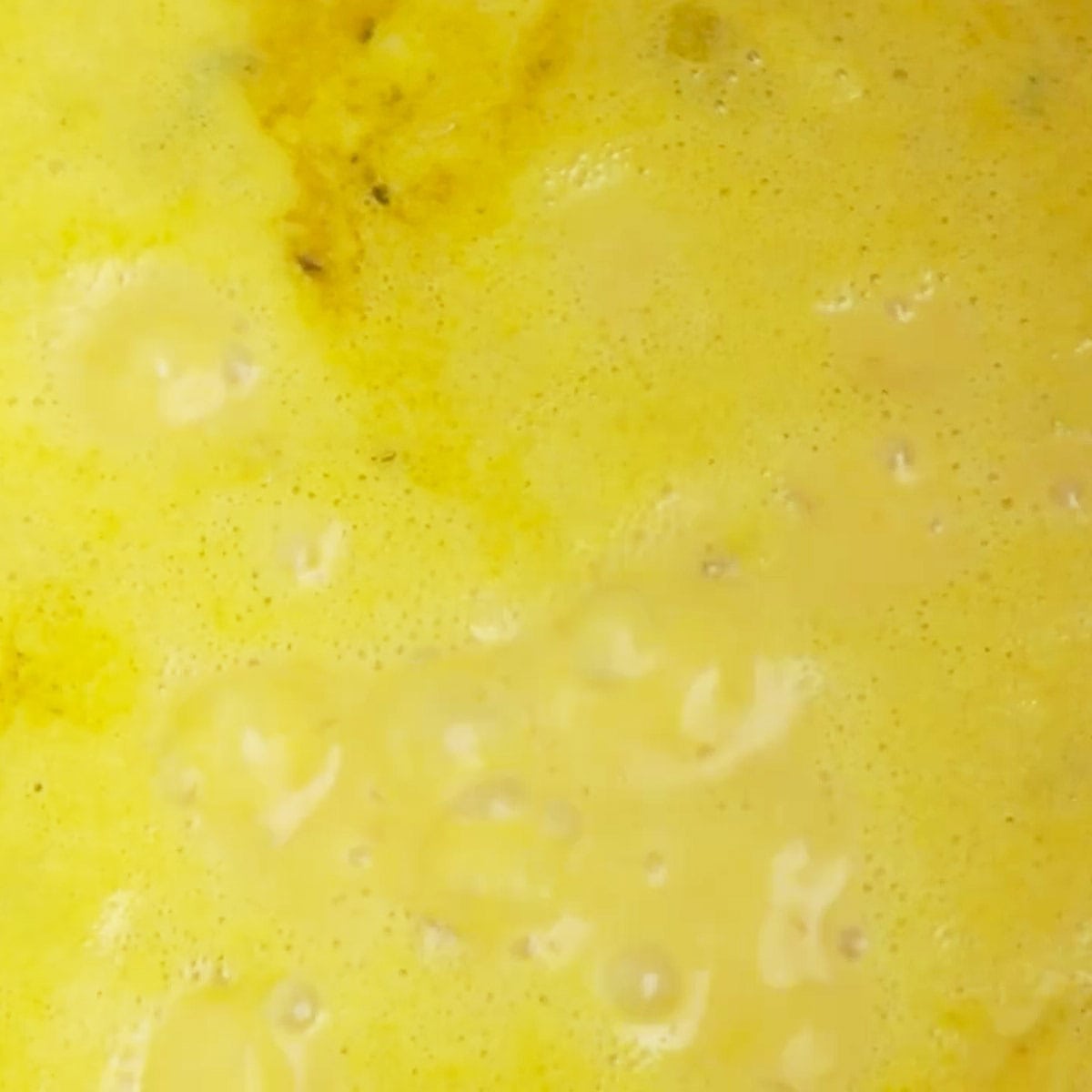 Simmering pumpkin cream soup.