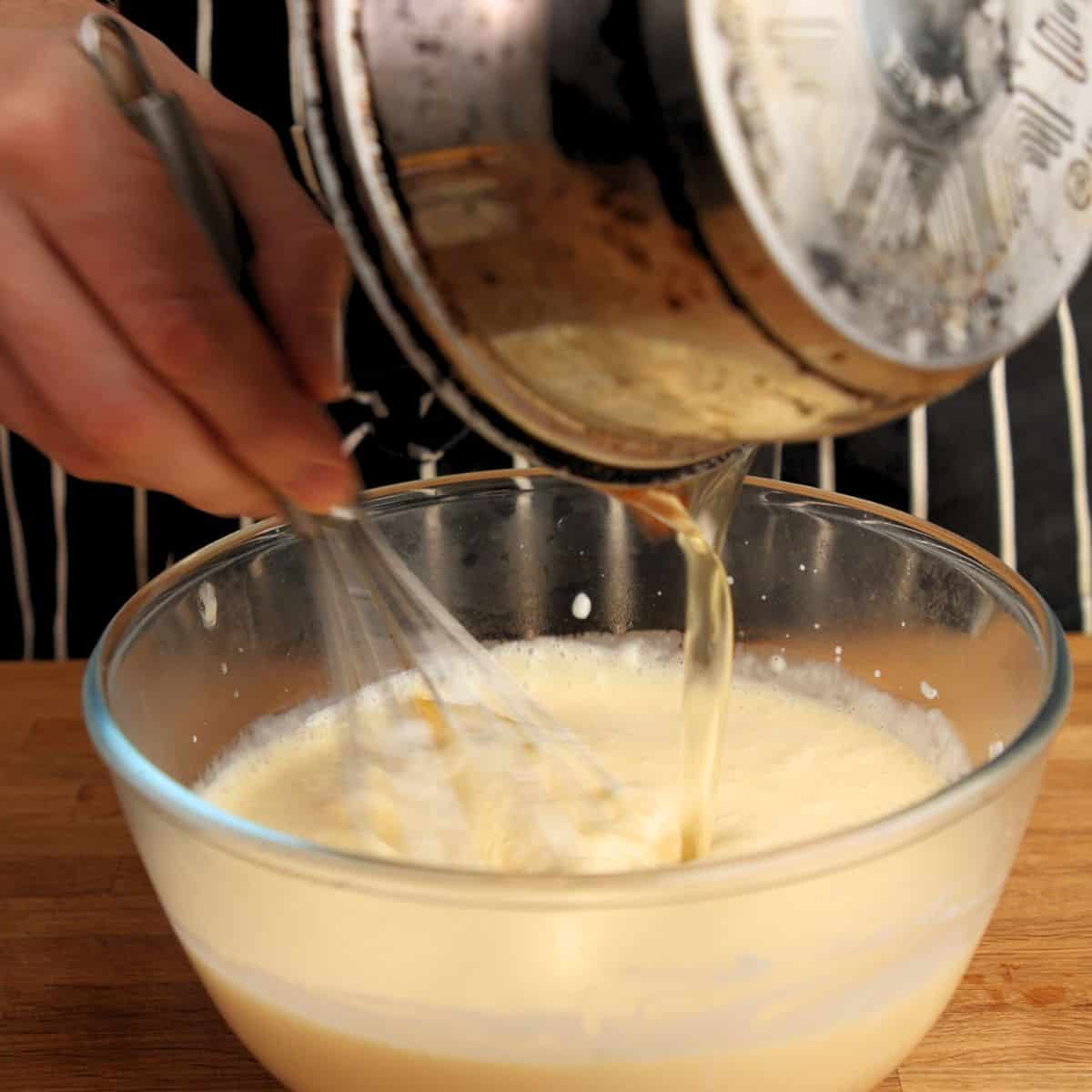 Pouring syrup into custard.