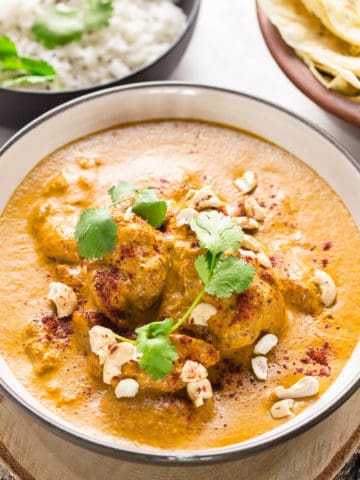 butter chicken in a white bowl