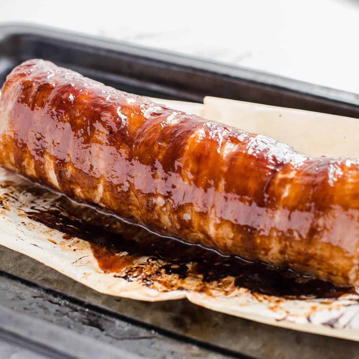 Perfectly glazed pork fillet in bacon