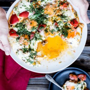 Baked eggs with tomato and smoked bacon