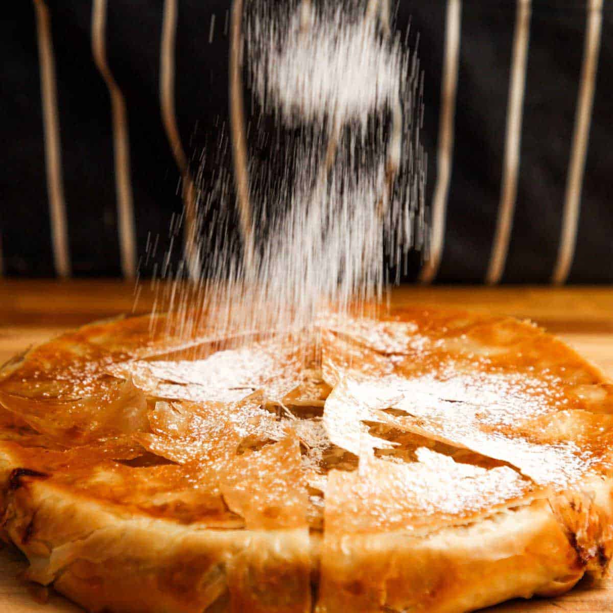 Baked pastilla with icing sugar.