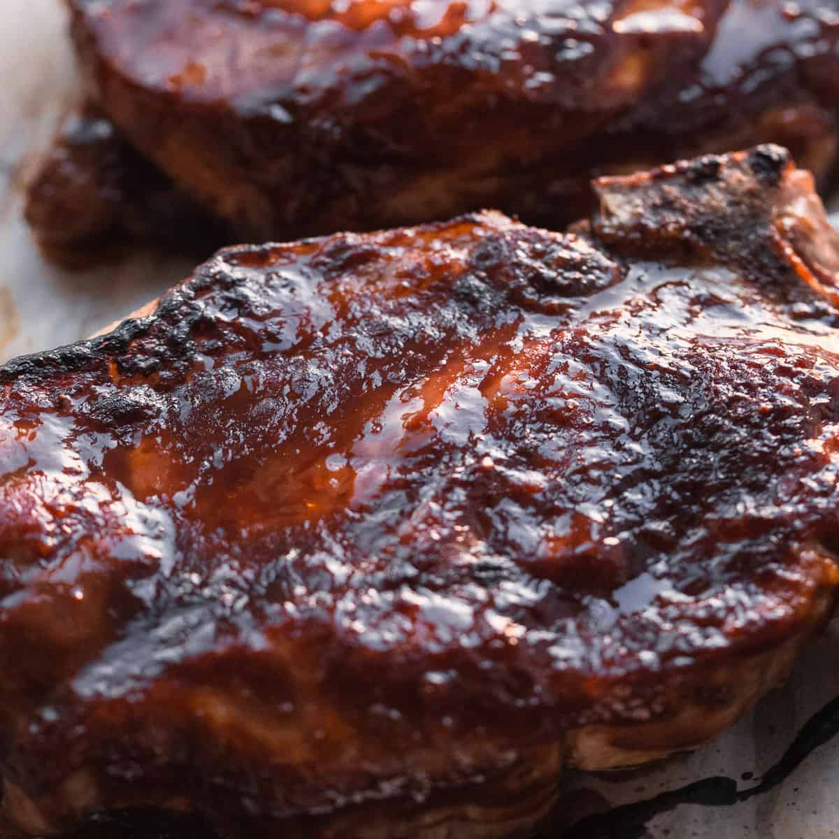 Pork chop glazed with barbecue sauce.