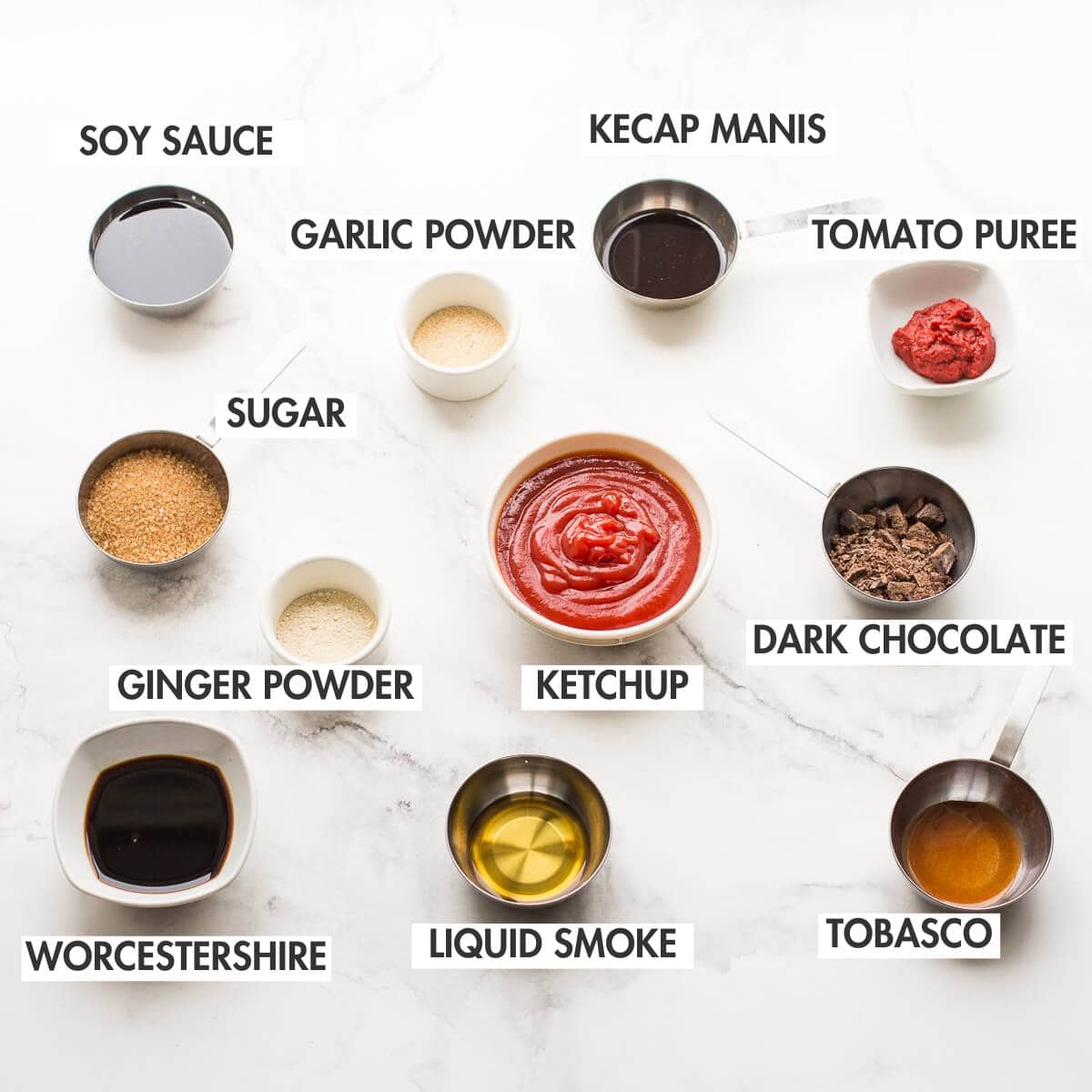 Barbecue sauce ingredients on a marble surface.