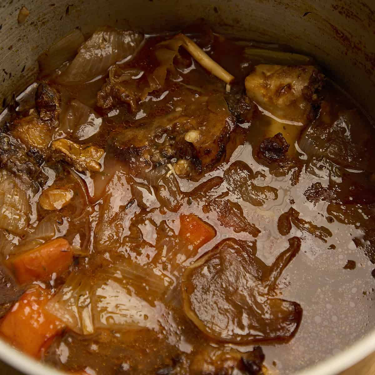 Cooked beef stock before straining out the solids.
