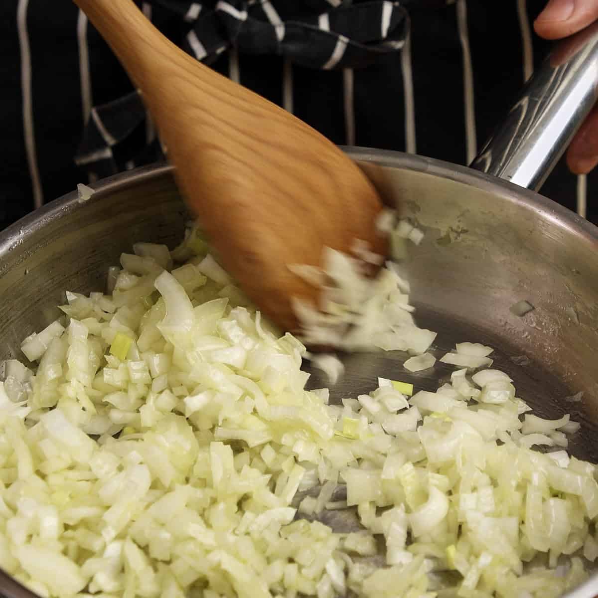 Frying onions in a pan.