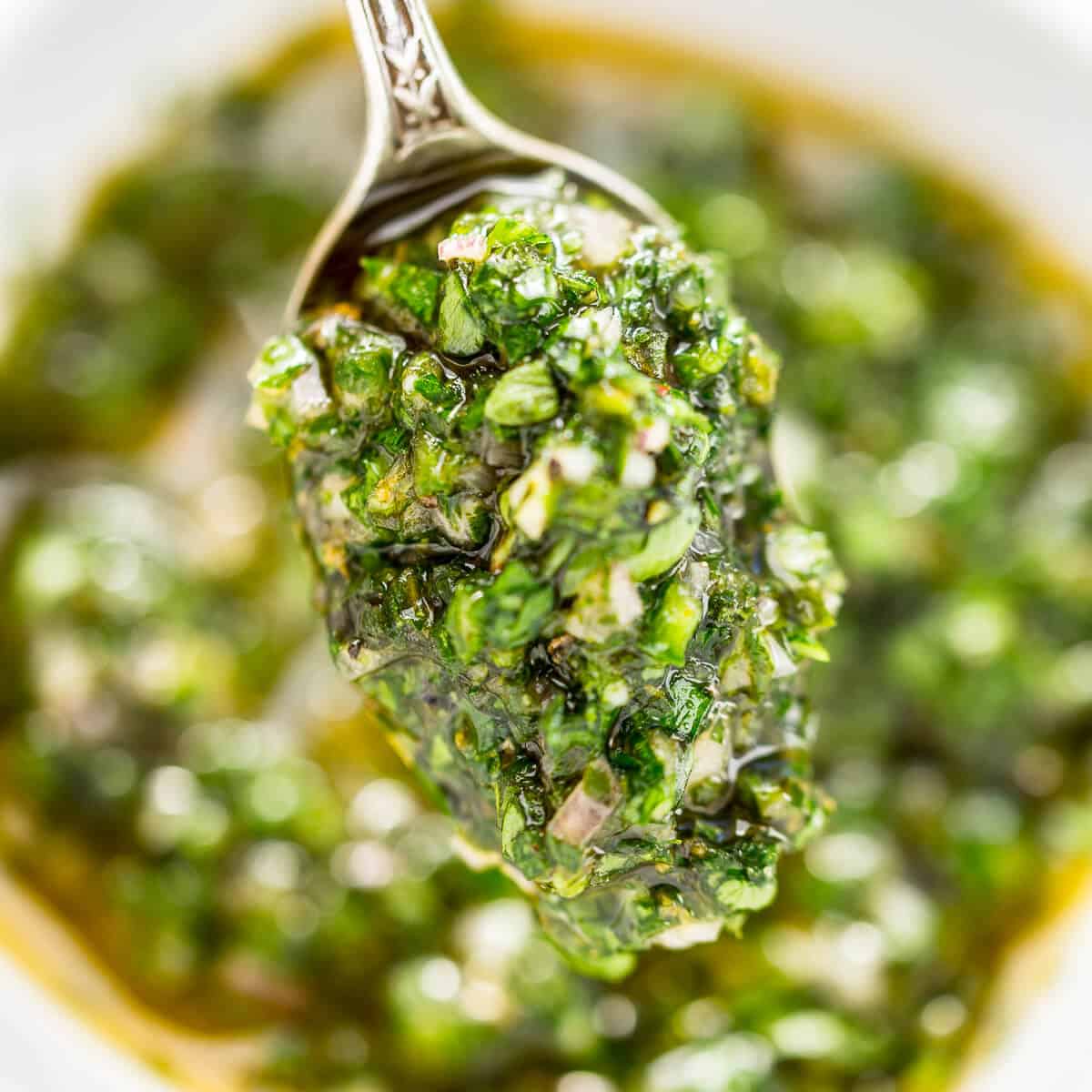 chimichurri sauce on silver spoon