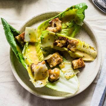 plated caesar salad on white plate