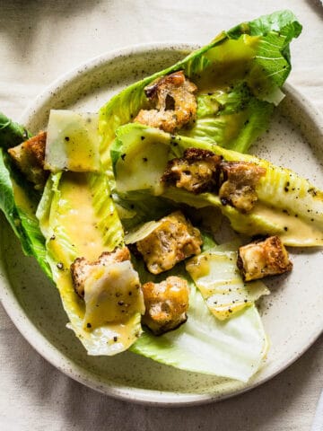 plated caesar salad on white plate