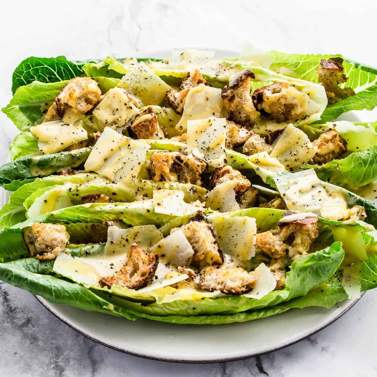 caesar salad on white plate