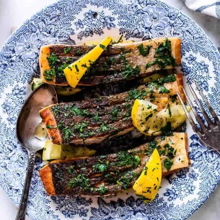 Seared salmon on a blue plate