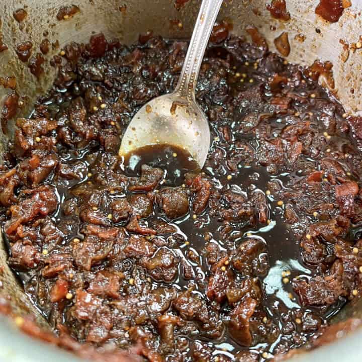 Cooked bacon jam in a sauce pan.
