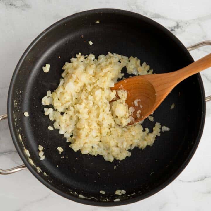 Cooking onions in a pan.