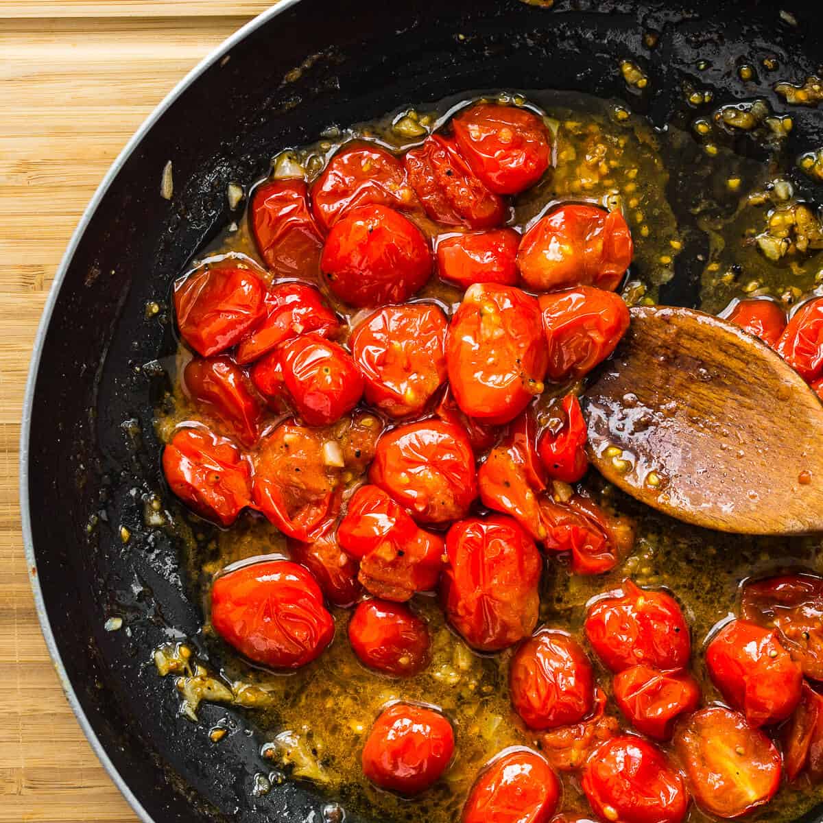 Cooked tomatoes in pan ready for pasta to be added.