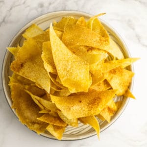 corn tortilla chips on a beige plate