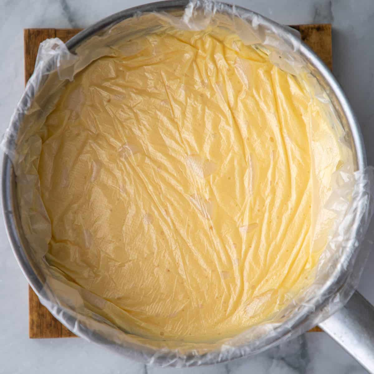 Custard covered in wrap to prevent skin forming.