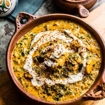 coconut chicken curry in brown bowl.