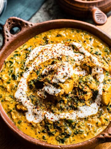 coconut chicken curry in brown bowl.