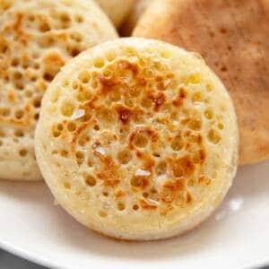 Crumpet on a white plate.