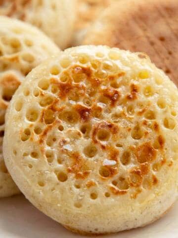 Crumpet on a white plate.