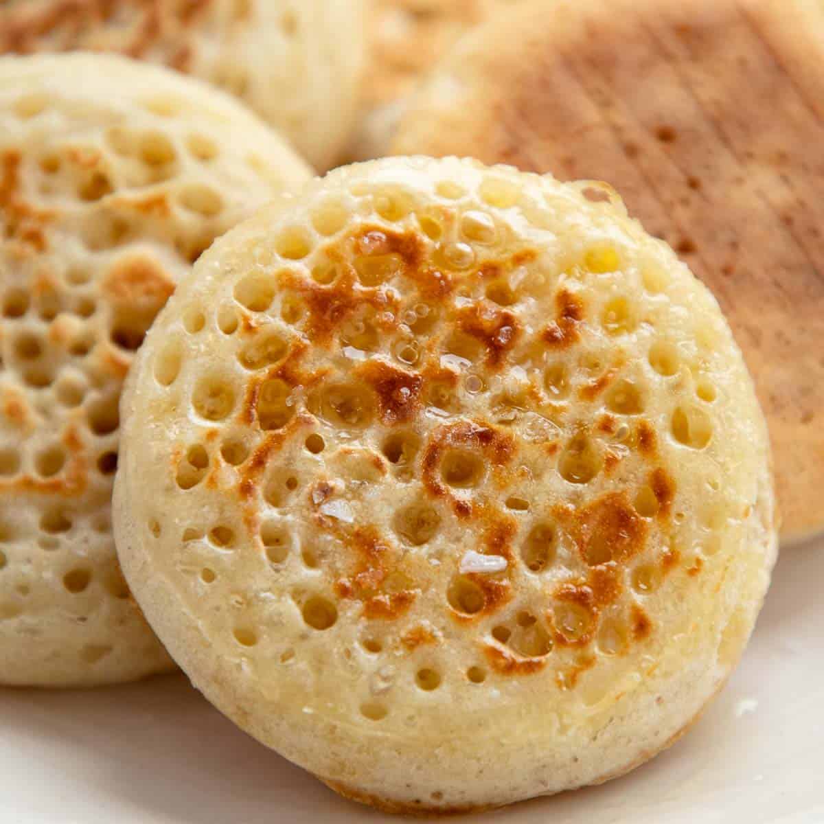 Crumpet on a white plate.
