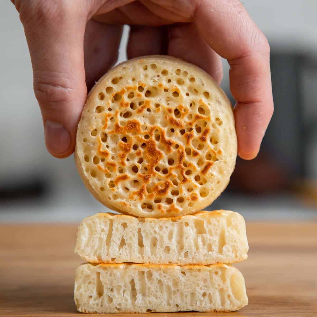 Crumpet on a wooden board.