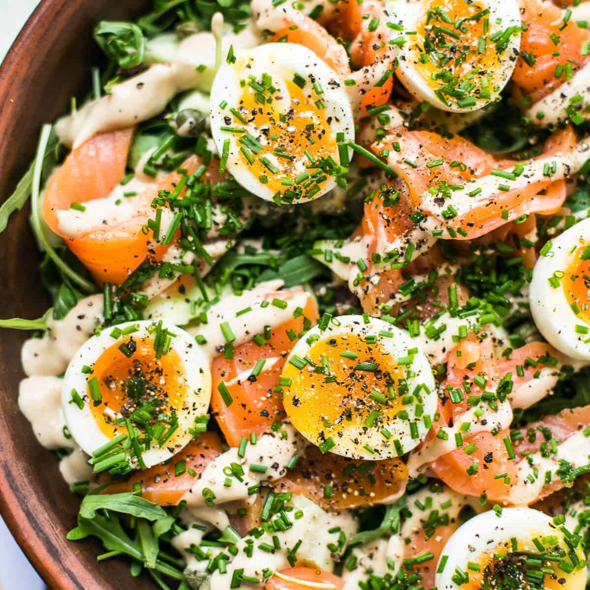 cured salmon salad in a brown bowl.