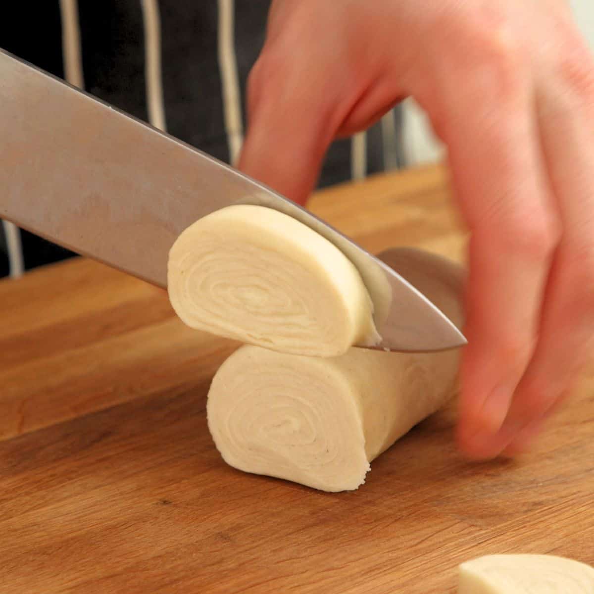Cutting pastry logs.