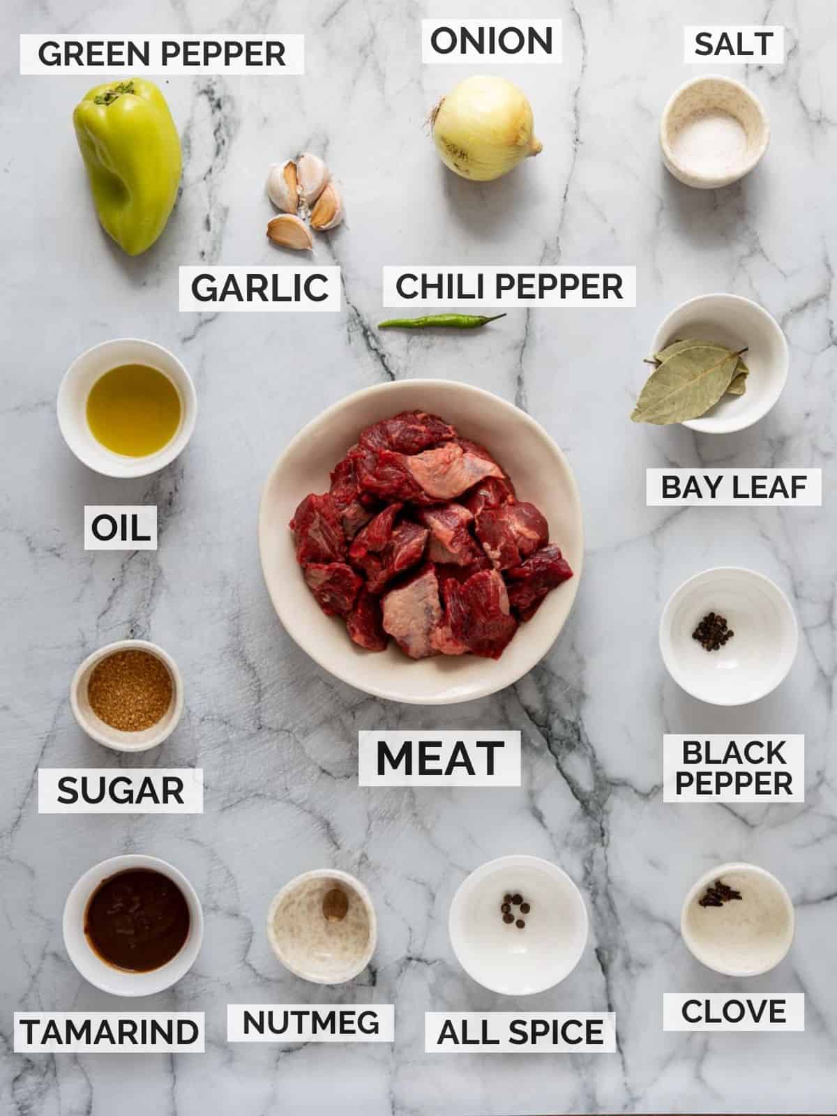 Denningvleis ingredients on a marbled board.