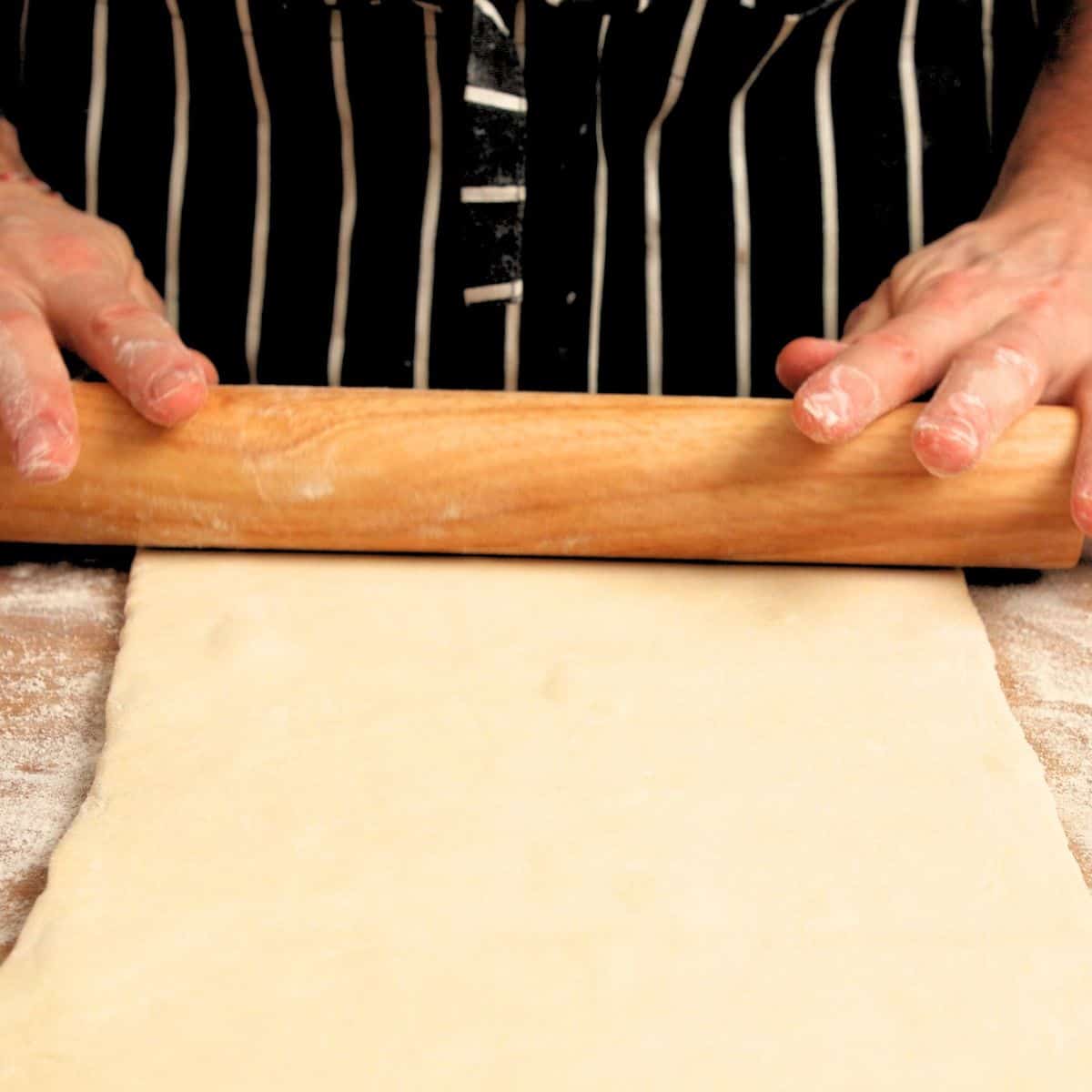 Rolling out pastry.