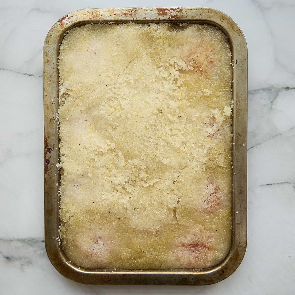 Moisture loss displayed by wet cure mixture on tray.