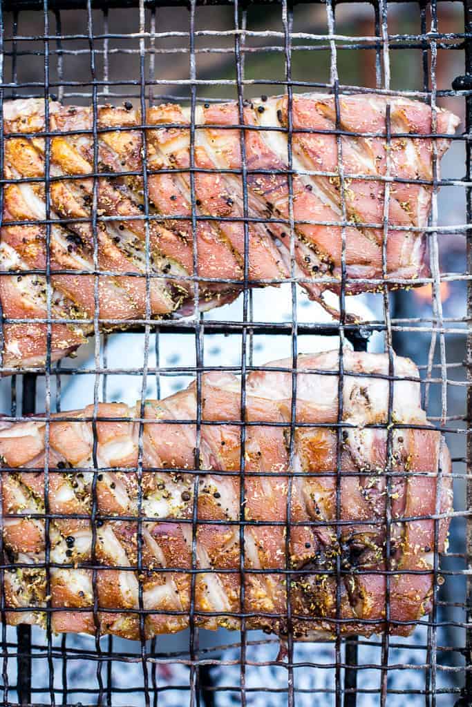 crispy pork belly on black grill