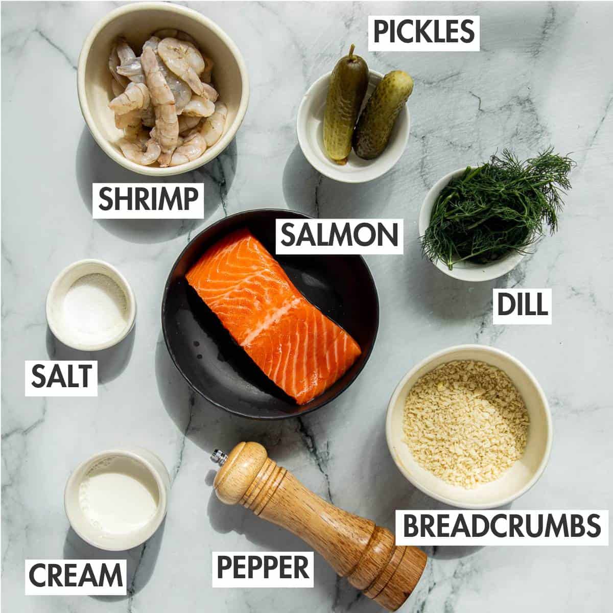 Fish pelmeni ingredients on a marble board.