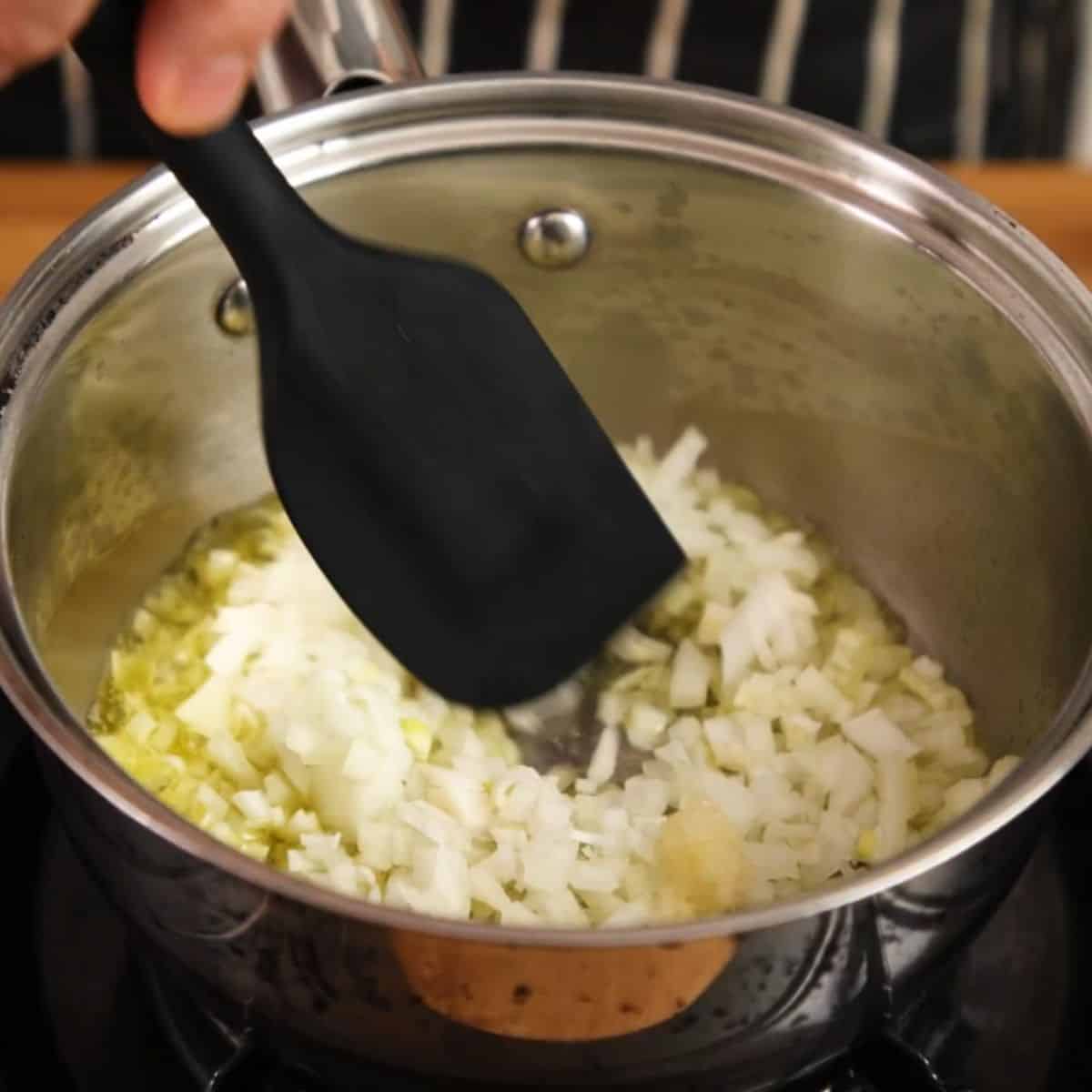 Frying aromatics in a pan.