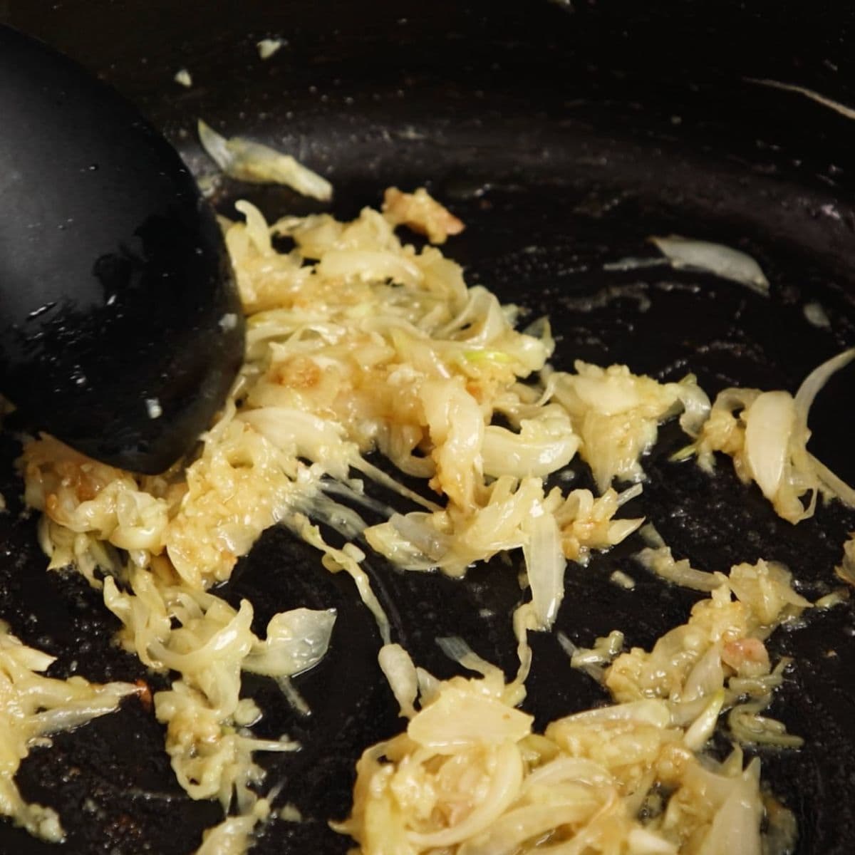 Frying onions in a pan.