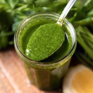 Gremolata dressing in a glass jar.