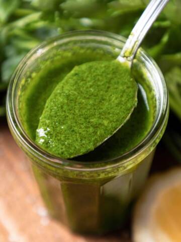 Gremolata dressing in a glass jar.