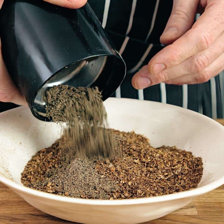 Mixing spices for biltong.