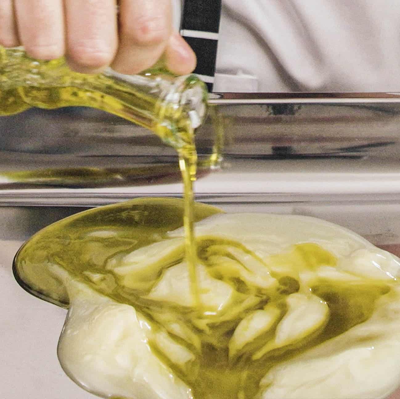 Fat and oil for roasting potatoes on a baking sheet.