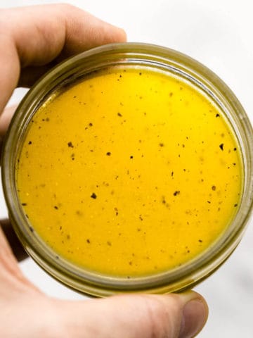 yellow honey dressing in glass jar