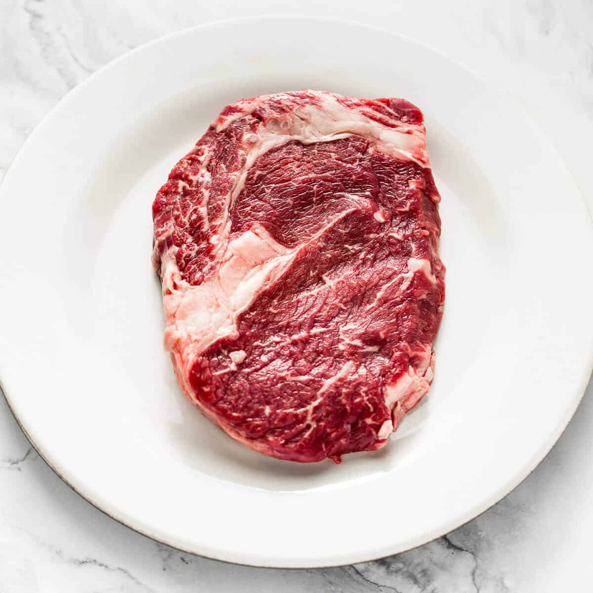 raw ribeye steak marbled beef