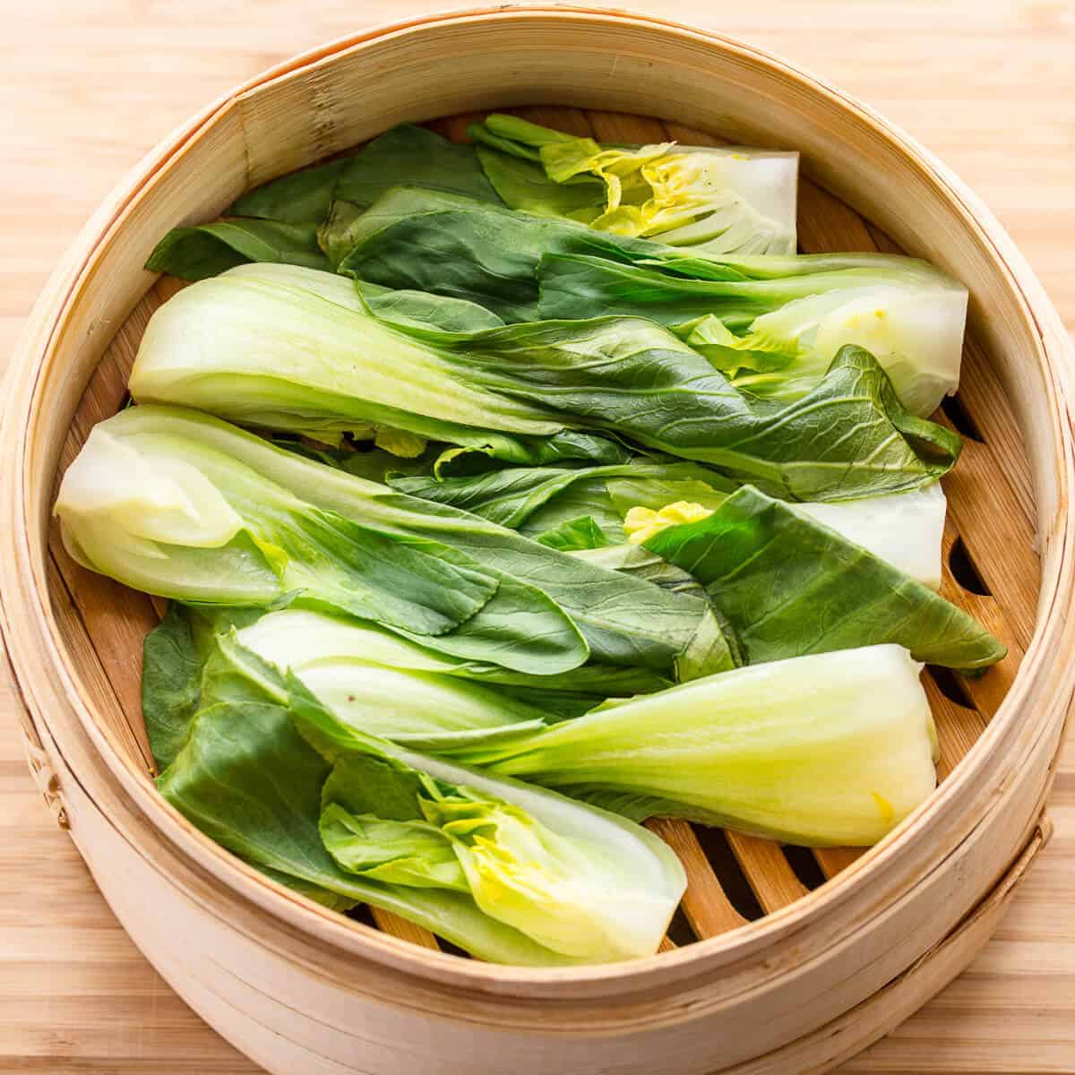 cut bok choy in steamer basket.