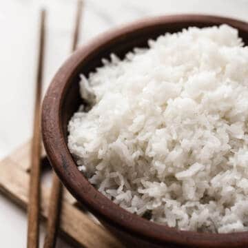 cooked rice in a brown bowl