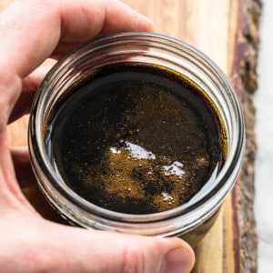 holding sweet soy in glass jar