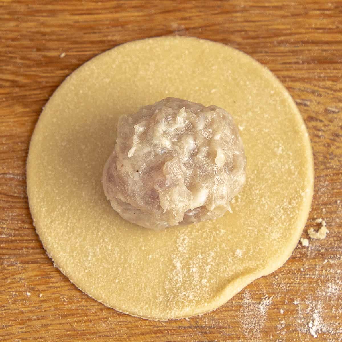 Mince filling on dough disc.