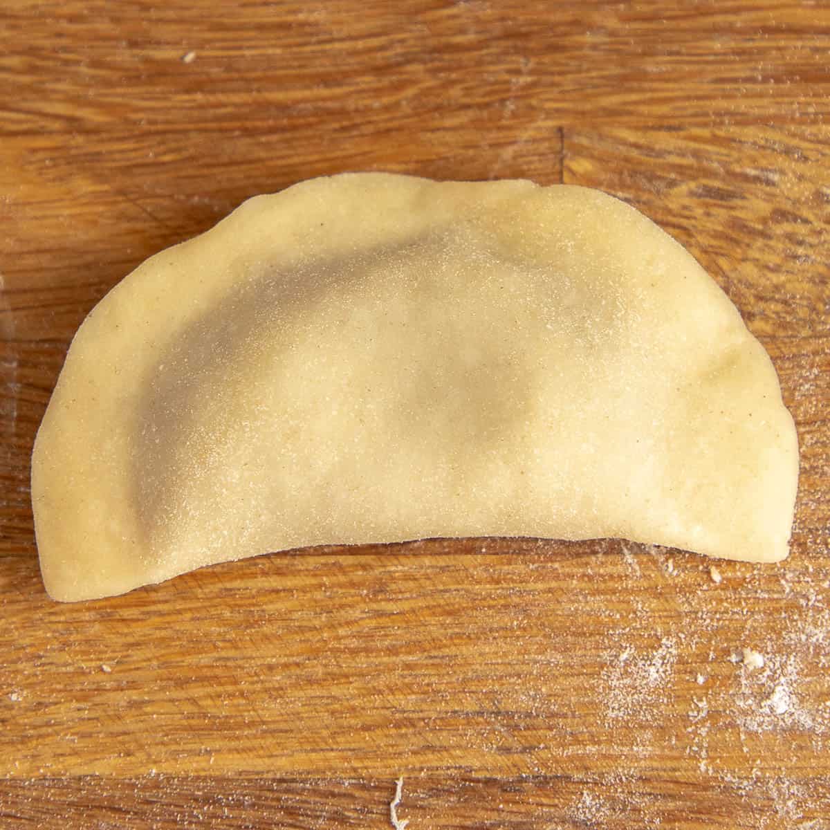 Half folded pelmeni.