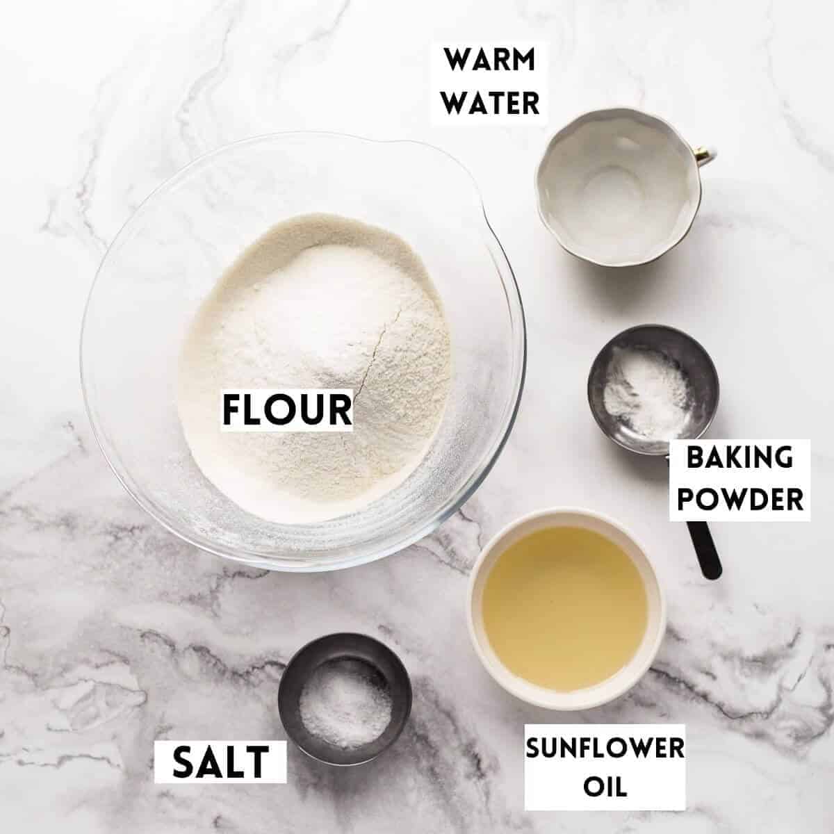 ingredients-for-making-homemade-flour-tortillas on marble background